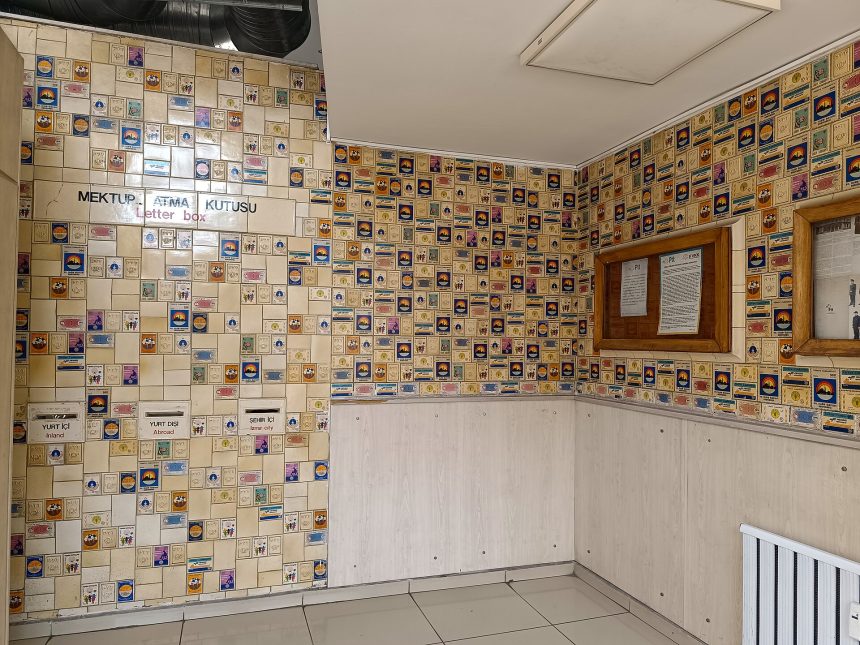 Interior of the Konak PTT post office in Izmir with rows of post office boxes